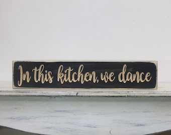 in this kitchen we dance lightly distressed wood sign