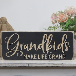 grandkids make  life grand lightly distressed wooden carve d sign