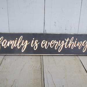 family is everything lightly distressed wood sign