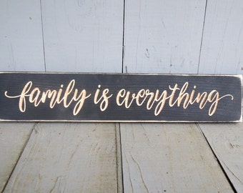 family is everything lightly distressed wood sign