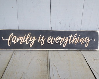 family is everything lightly distressed wood sign