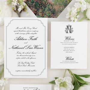 May include: Elegant wedding stationery set featuring invitation cards, a welcome card, and a response card. The invitation includes the names Addison Faith and Nathaniel Luis Warner. The envelope has a floral painting. White flowers and greenery surround the cards.
