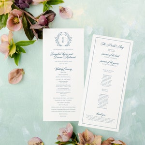 May include: Wedding ceremony program with a blue and white floral design. The program includes the names of the bride and groom, the officiant, the bridal party, and the wedding ceremony order. The program also includes a thank you message to the guests.