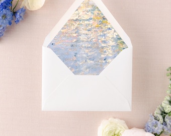 May include: A white envelope with a blue and yellow patterned liner. The envelope is surrounded by white, yellow, and blue flowers.