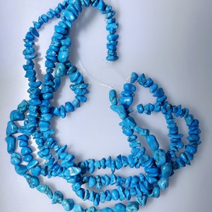 Four strands bright blue dyed Howlite chip and nugget beads, 655 carats total               040-014-001