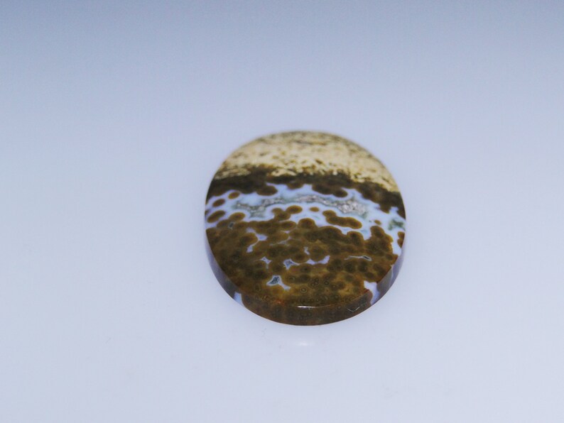 33.13 carats 046-10-007 Unique Ocean Jasper oval cabochon druzy included