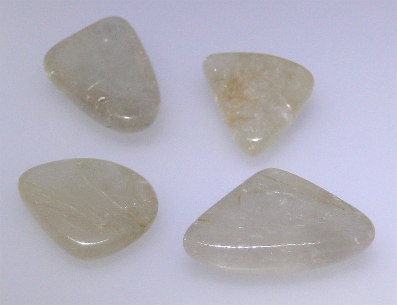 various shapes and sizes Four gold rutilated Quartz cabochons 64.12 carats total WHGC-0082