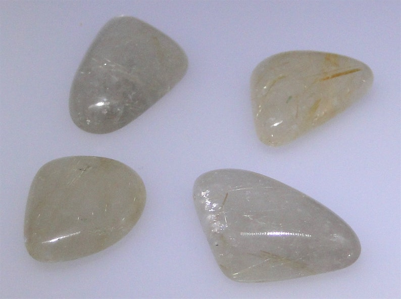 various shapes and sizes Four gold rutilated Quartz cabochons 64.12 carats total WHGC-0082