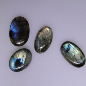 Four Labradorite oval cabochons, very good multi color flashes, 140.10 carats total     051-10-094