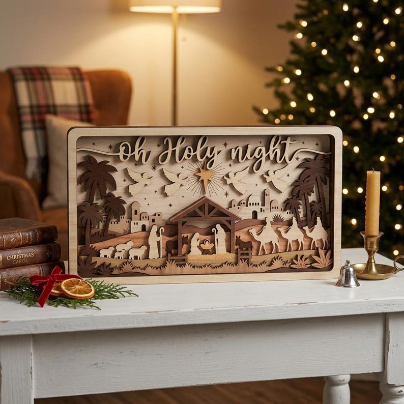 May include: A rectangular wooden nativity scene featuring layered cutouts of the Holy Family, camels, sheep, and angels under a star. The text "Oh Holy night" is carved into the top section. The design uses varying shades of natural wood.
