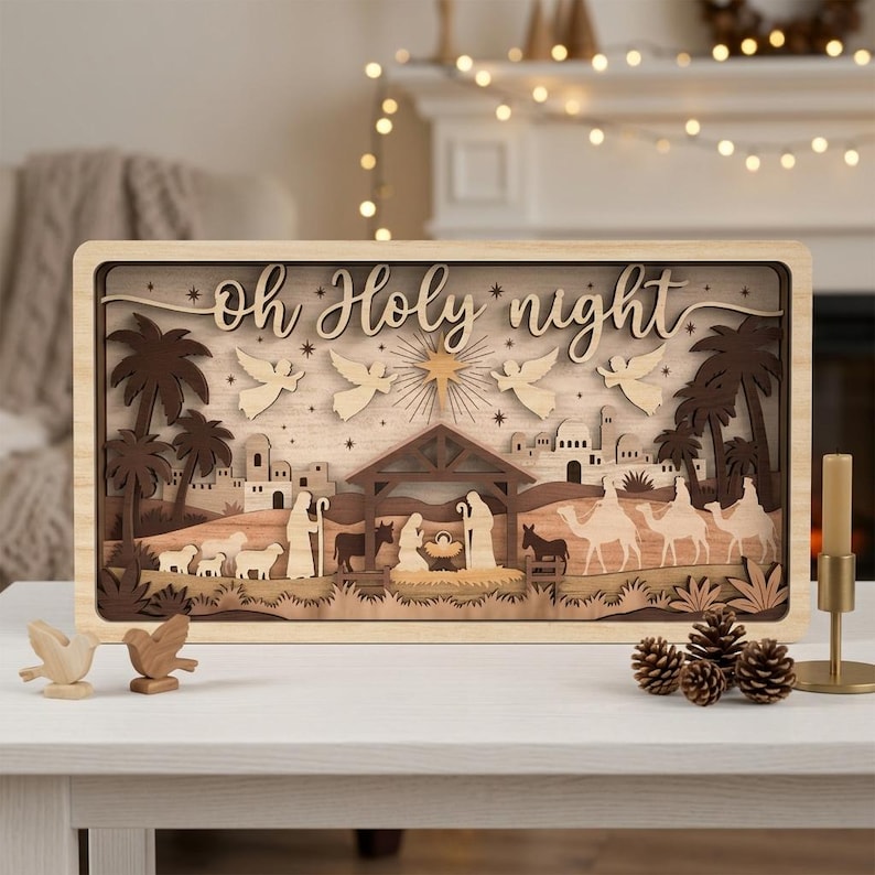 May include: A rectangular wooden layered nativity scene featuring the text Oh Holy Night, depicting a manger, figures, camels, sheep, palm trees, and angels under a star. The scene is crafted from various shades of light and dark wood.