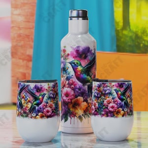 May include: A white water bottle and two stemless wine glasses feature a vibrant hummingbird and floral design. The hummingbird has iridescent green, blue, and purple feathers. The flowers are pink, purple, and orange.
