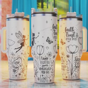 May include: Three white stainless steel tumblers with black and white floral designs and inspirational quotes. The quotes are "Believe", "Leave a little sparkle wherever you go", and "Faith, trust & pixie dust".