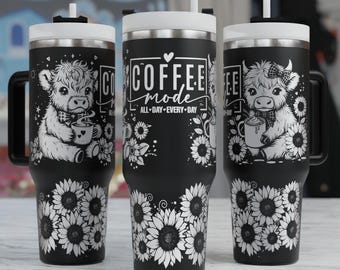 May include: Three black stainless steel tumblers with a white lid and a straw. The tumblers feature a black and white design of a cow with a bow, sunflowers, and the text "Coffee Mode All Day Every Day".