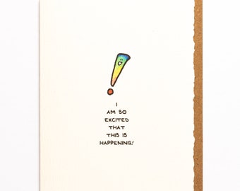 May include: A white card with a rainbow exclamation mark with a smiley face and the text "I am so excited that this is happening!"