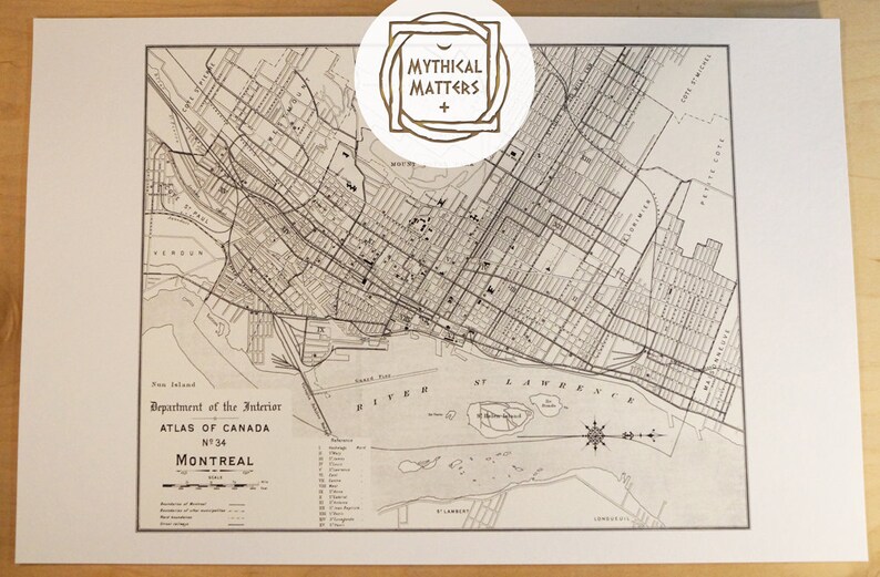 May include: A vintage map of Montreal, Canada, from the Department of the Interior, Atlas of Canada, No. 34. The map shows the city's streets, rivers, and islands.