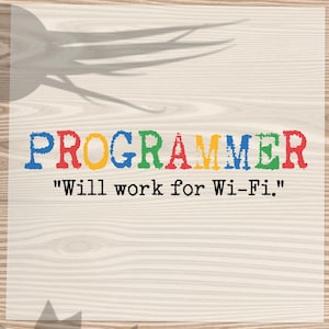 May include: A square graphic with the word "PROGRAMMER" in colorful letters, with the phrase "Will work for Wi-Fi." below it. A dark blue shirt is in the background. A potted plant and a leafy plant are also visible.