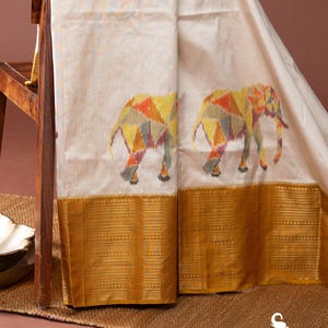 Pure white and yellow Ikat silk saree with kanchi borders fusion handwoven elephant design, Silk Mark certified, lightweight & ready to wear