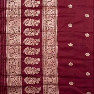Dark Green Assam Silk Saree Woven with Zari Buttas and Stripes, Complemented by a Contrast Traditional Zari  Design Border, a Captivating Pallu Featuring Zari Designs, and Paired with a Contrast Blouse main image 1