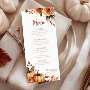 K&ouml;nnte beinhalten: Eine Thanksgiving-Men&uuml;karte mit einem Aquarelldesign. Das Men&uuml; zeigt ein Blumenarrangement mit K&uuml;rbissen und Rosen. Das Men&uuml; enth&auml;lt den Text "Men&uuml;" und den Namen "The Wellington Thanksgiving 2024".
