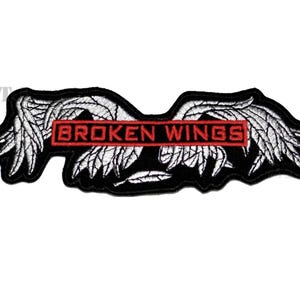 May include: Black and white embroidered patch with two wings and a red rectangle with the text "BROKEN WINGS" in white.