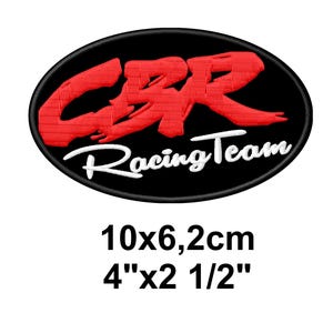 May include: Embroidered patch with a black oval background. The patch features the red letters "CBR" above the white text "Racing Team". The patch measures 4" x 2 1/2".