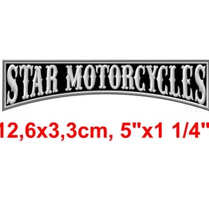 May include: A black and white rectangular sign with the words "STAR MOTORCYCLES" in a stylized font. The sign is 5" x 1 1/4" (12.6 x 3.3 cm).