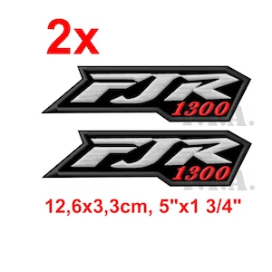 May include: Two embroidered patches with the text "FJR 1300" in white and red on a black background. The patches measure 12.6 x 3.3 cm and are labeled with the number "2x" in red.