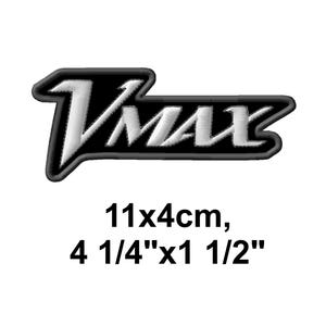 May include: Embroidered patch with the word "Vmax" in white, outlined in black, on a black background. The patch measures 4 1/4" x 1 1/2".
