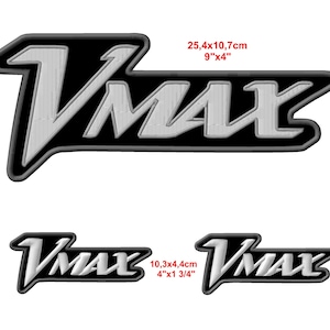 May include: Embroidered VMAX patches in three sizes. The largest patch is 9" x 4" (25.4cm x 10.7cm), with the VMAX text in white against a black background. Two smaller patches are also shown, one 4" x 1 3/4" (10.3cm x 4.4cm).