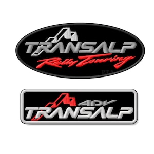 May include: Two black embroidered patches with white and red lettering. The top patch is oval shaped and says "Transalp Rally Touring". The bottom patch is rectangular and says "Transalp ADV".