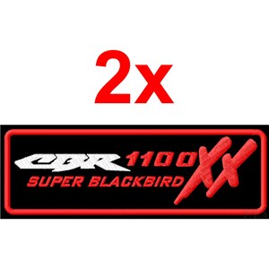 May include: Two embroidered patches with the text "2X" above a rectangular patch. The patch has a black background with red trim and features the text "CBR 1100 SUPER BLACKBIRD" in white and red.