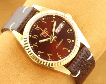 1980s Vintage refurbished automatic Seiko 5 arabic elegant  brown dial golden men's working wrist watch 35mm.. authentic and iconic