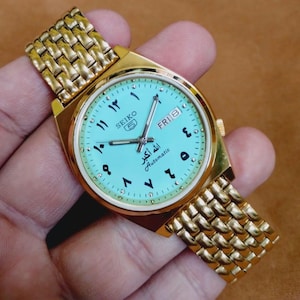 Vintage automatisk Seiko 5 turkos urtavla gyllene arabiska siffror herrarmbandsur 37,5 mm...tillverkad i Japan