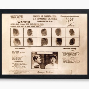 May include: A vintage wanted poster featuring a black and white photograph of a man. The poster includes the man's name, George Nelson, and a description of his physical appearance. The poster also includes a fingerprint classification and a criminal record. The poster is titled "Wanted" and is from the Division of Investigation, U.S. Department of Justice.