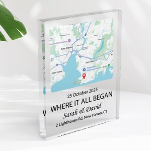May include: A clear acrylic block featuring a map of New Haven, CT, with a blue and white design. The block includes the text "WHERE IT ALL BEGAN" and the date "25 October 2025", along with names and an address.