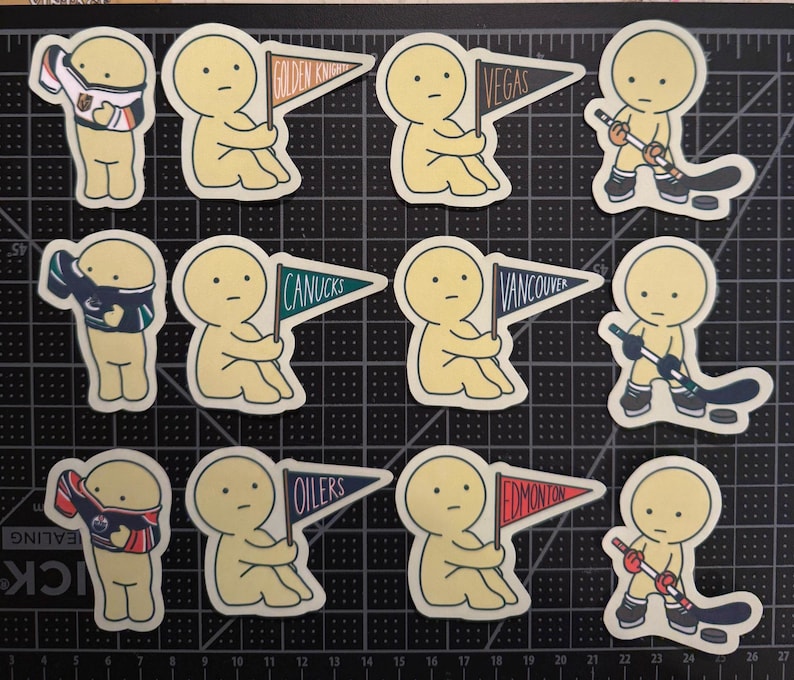 May include: A collection of twelve die-cut stickers featuring a pale yellow cartoon character in various hockey-themed poses, including holding pennants labeled Golden Knights, Vegas, Canucks, Vancouver, Oilers, and Edmonton, or playing with a hockey stick.