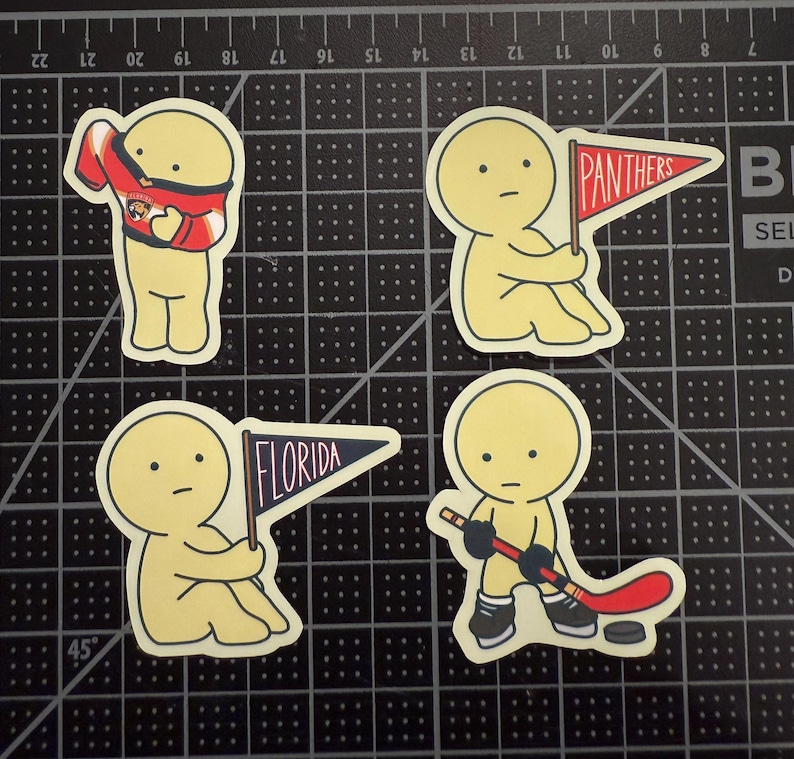May include: Four die-cut stickers featuring a pale yellow cartoon character. One wears a red and blue hockey jersey, one holds a red pennant with the text PANTHERS, one holds a blue pennant with the text FLORIDA, and one holds a hockey stick.