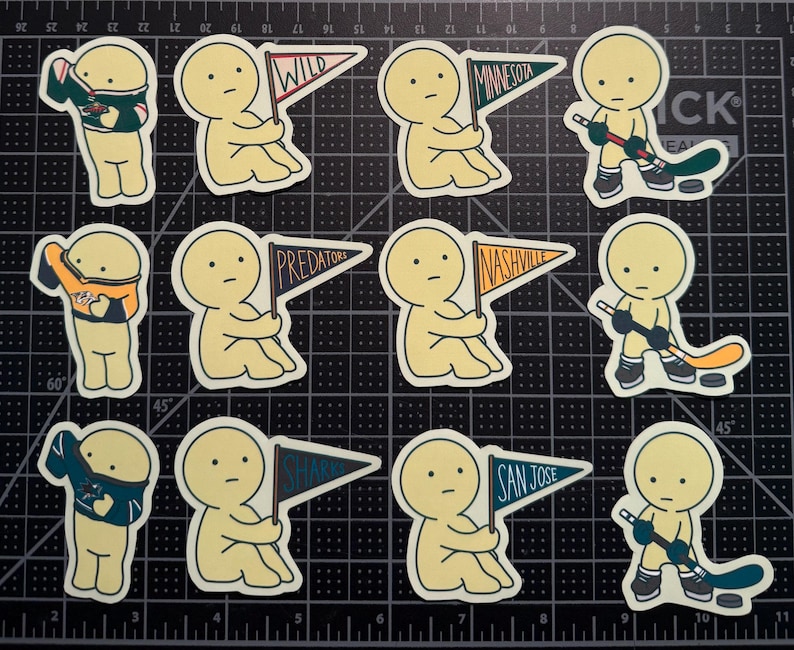 May include: A collection of twelve die-cut stickers featuring cartoon figures in various poses. Some figures hold pennants labeled Wild, Minnesota, Predators, Nashville, Sharks, and San Jose, while others wear hockey jerseys or hold hockey sticks.