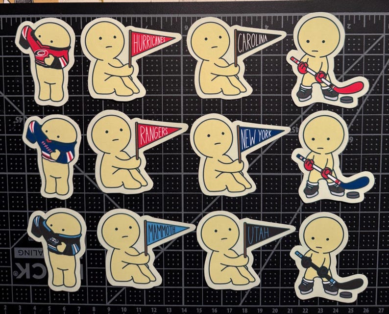 May include: A collection of twelve die-cut stickers featuring pale yellow cartoon figures. Some figures hold pennants labeled Hurricanes, Carolina, Rangers, New York, Mammoth, and Utah. Others wear sports jerseys or hold hockey sticks with pucks.