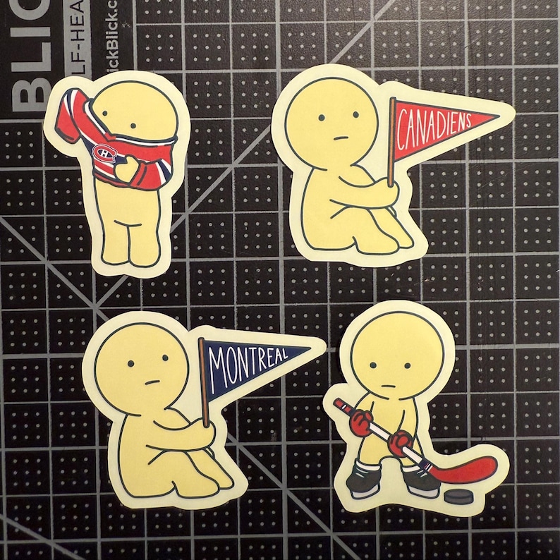 May include: Four die-cut stickers featuring a yellow cartoon character. One wears a red, white, and blue hockey jersey. Another holds a red pennant with the text CANADIENS. A third holds a blue pennant with MONTREAL. The fourth holds a hockey stick.