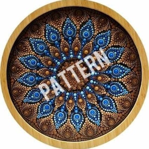 May include: A wooden tray featuring a circular mandala design painted in blue and brown. The mandala has a repeating pattern of dots and swirls.