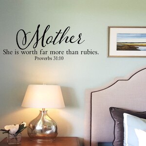 May include: A bedroom with a light green wall, a white headboard, and a quote on the wall that reads "Mother She is worth far more than rubies. Proverbs 31:10".