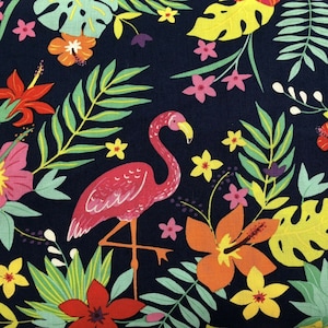 May include: A pink flamingo with a long neck and long legs stands on a dark blue background with a tropical floral pattern. The flowers are in shades of red, yellow, orange, and green.