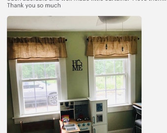 May include: Two windows with burlap valances and black curtain rods. A decorative metal sign that says "HOME ME" is between the windows. A child's play kitchen is below the windows. The text above the windows says "Such adorable and well made little curtains. I love them!! Thank you so much."