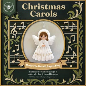 May include: A Christmas-themed ornament featuring a felt angel with white wings and a white dress with gold star accents. The image includes the text "Christmas Carols" and "Hark! The Herald Angels Sing."