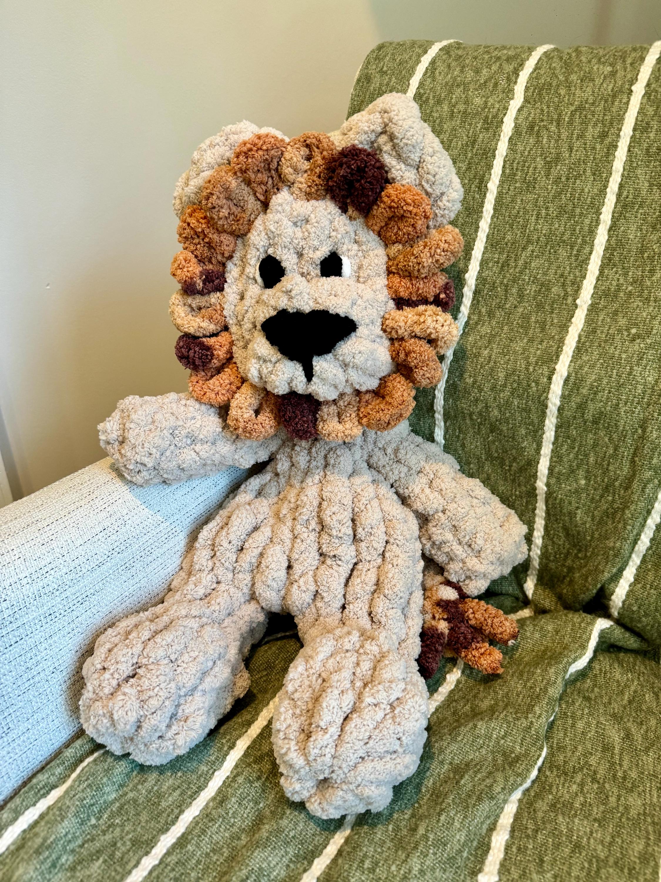 Handgestrickter Löwe Snuggler