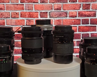 3rd party 135mm  f/2.8 FD mount wide angle prime lens.