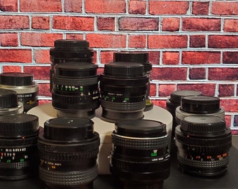 3rd party 28mm or 24mm f/2.8 FD mount wide angle prime lens.