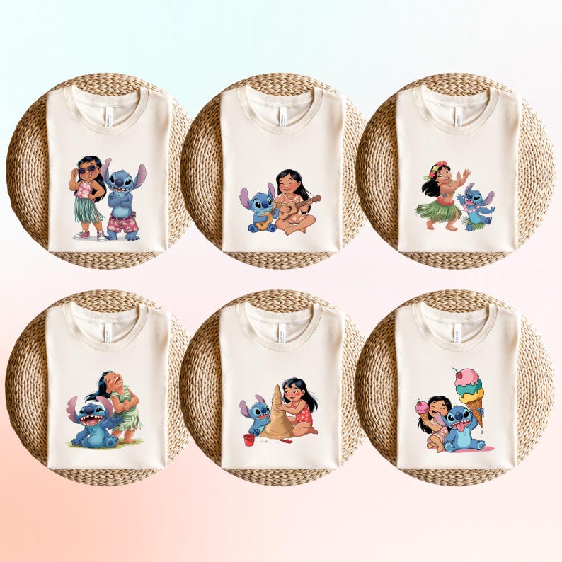 May include: Six off-white t-shirts featuring colorful cartoon graphics of Lilo and Stitch in various poses. Each shirt is placed on a round, woven mat. The designs include Lilo with Stitch, playing the ukulele, and building a sandcastle.